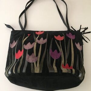 Adorable and fun black suede bag with a front tulip motif and 3-d ladybug.